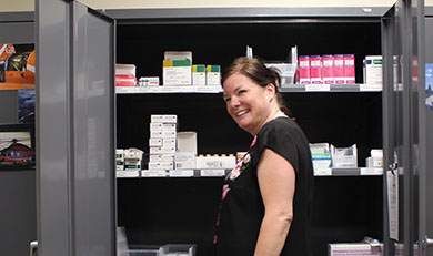 Catherine Dawes standing in front of medication