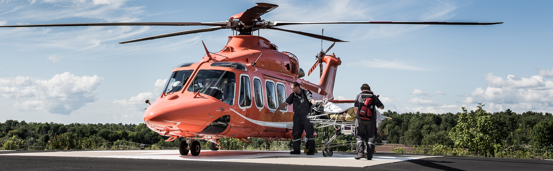 A group of paramedics waking towards an Ornge helicopter