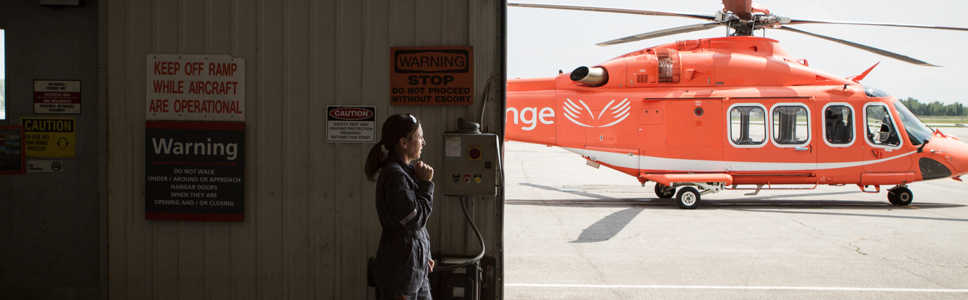 An Ornge employee talking with a headset on