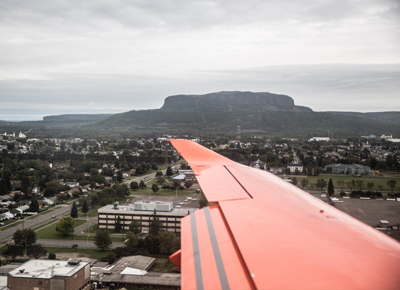 Two Ornge helicopters in flight