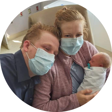 parents holding their newborn