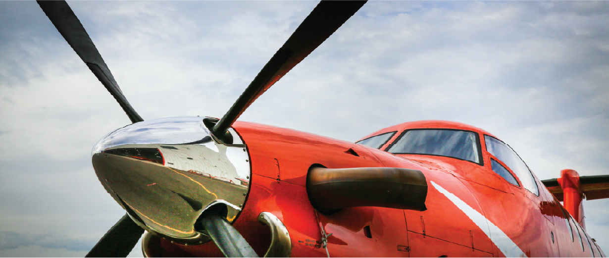 the propeller of an orange plane