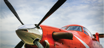 the propeller of an orange plane