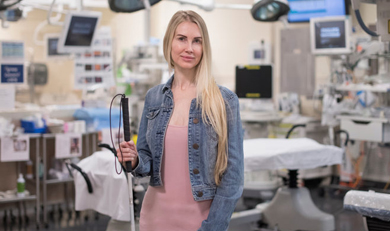 Sarah standing in a Sunnybrook Hospital operation room