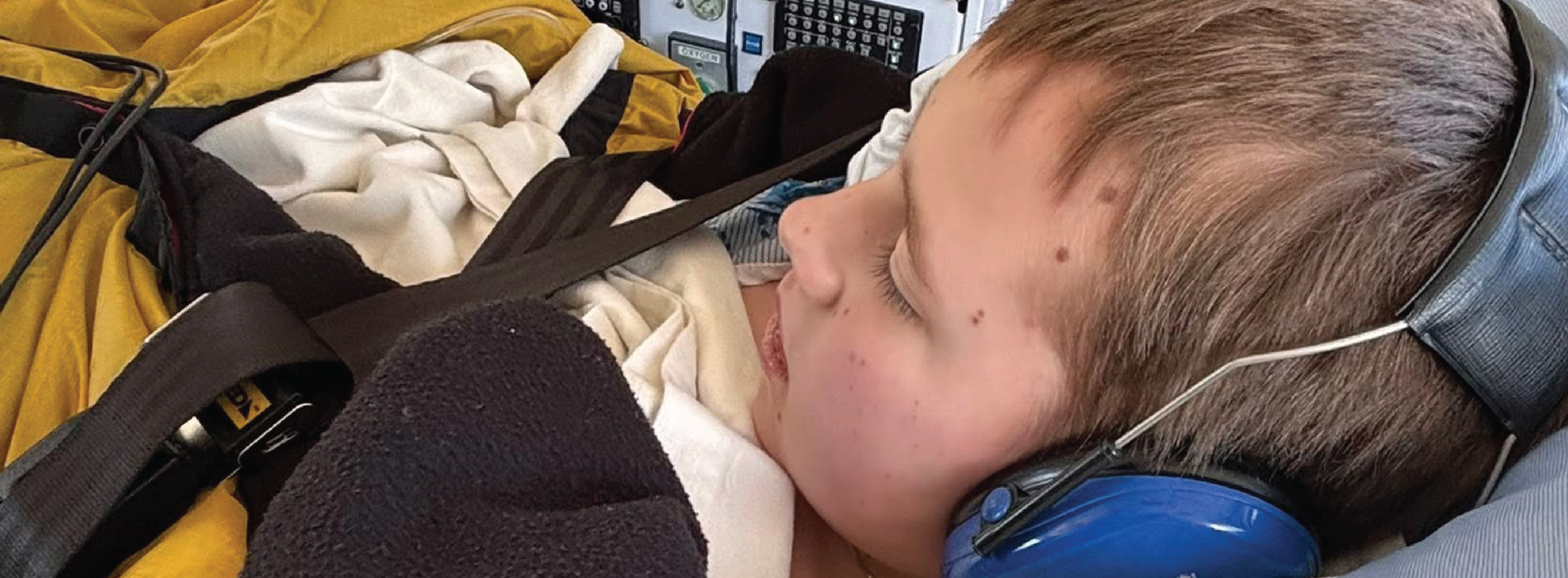 Josiah Watts on a stretcher in an Ornge helicopter