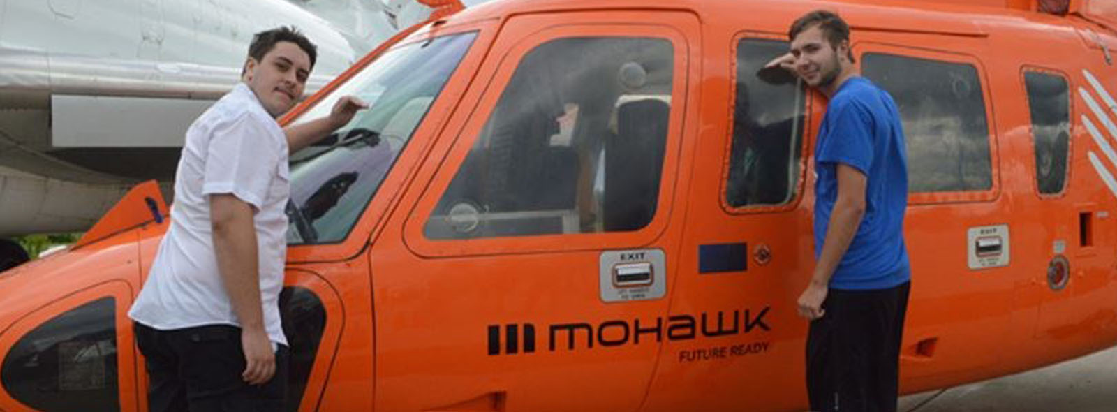 Mohawk College students in front of donated Sikorsky helicopter