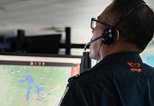 Ornge staff person monitoring flights on computer screens