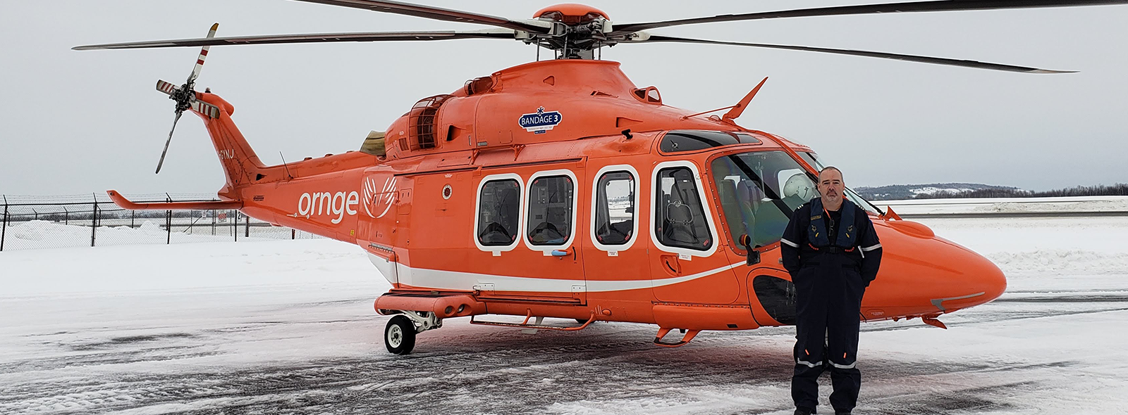 Liam Dowd standing in front of a rotor wing