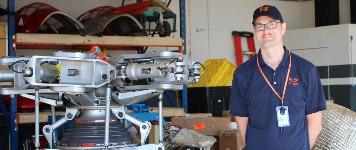 A picture of Jason Hick AME working on an engine from an Ornge helicopter