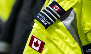 A paramedic using a health kit on an Ornge helicopter