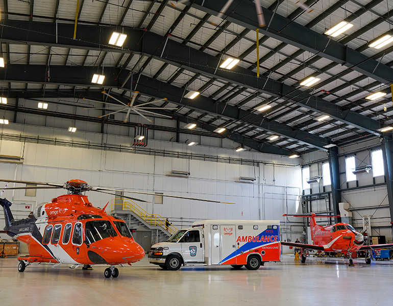 An image of an Ornge employee working in the corporate sector wearing a headset